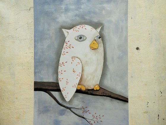 The freaky white owl on the branch