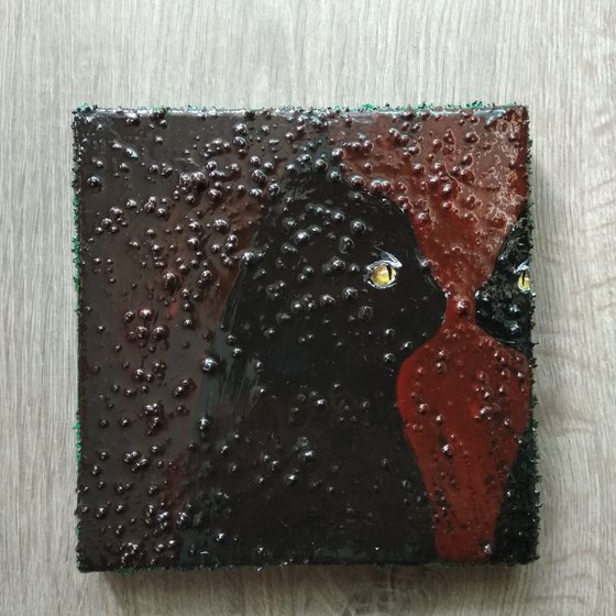 "Cat looking in to the mirror"