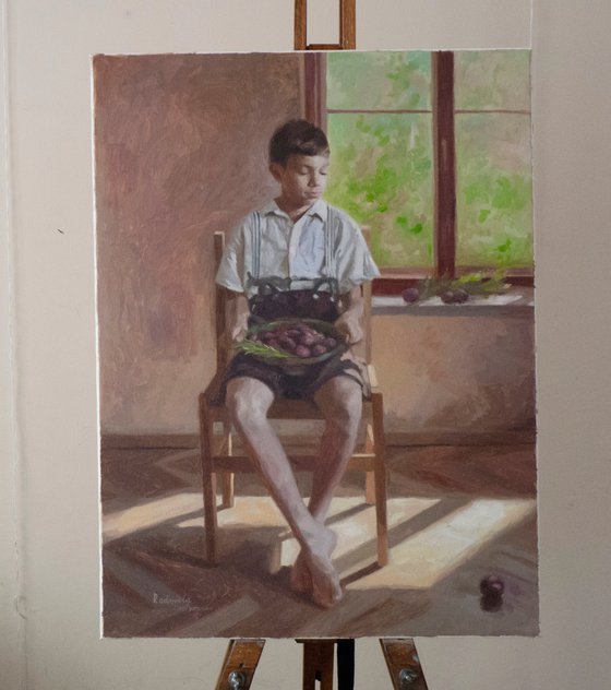 Boy with plums
