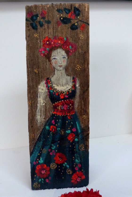 Totem sculpture Slavic woman on painted wood.