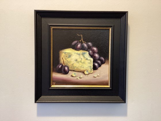 Cheese and grapes still life