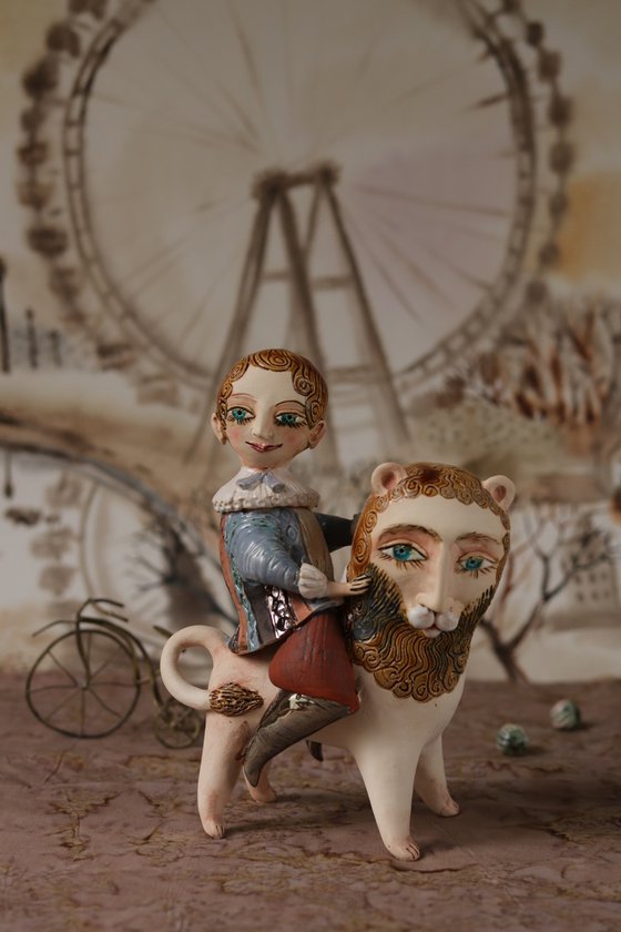 Vintage dressed boy riding a lion. From "Le Carousel, Hommage à l'Innocence" project by Elya Yalonetski