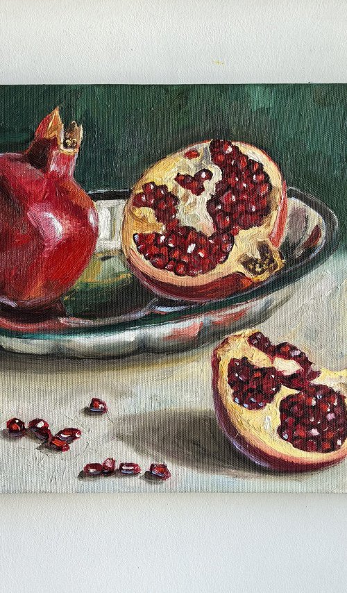 Pomegranates on metal tray by Leyla Demir