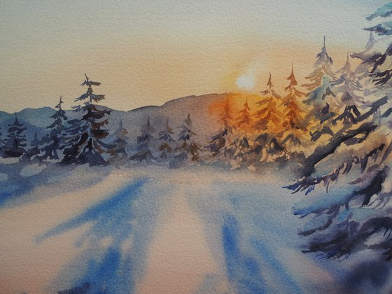 Snowy forest at sunset
