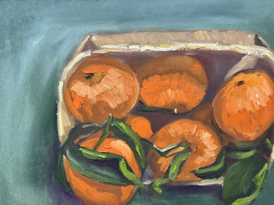 Tangerines in a wooden basket