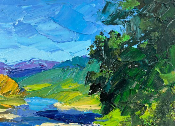 River against the Backdrop of Mountain Slopes