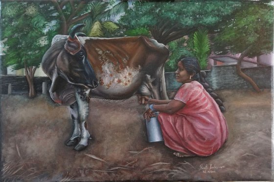 Woman milking the cow