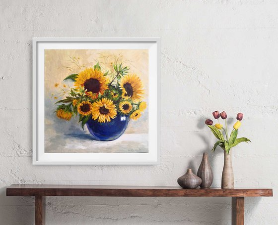 Sunflowers bouquet in a blue glass vase still life