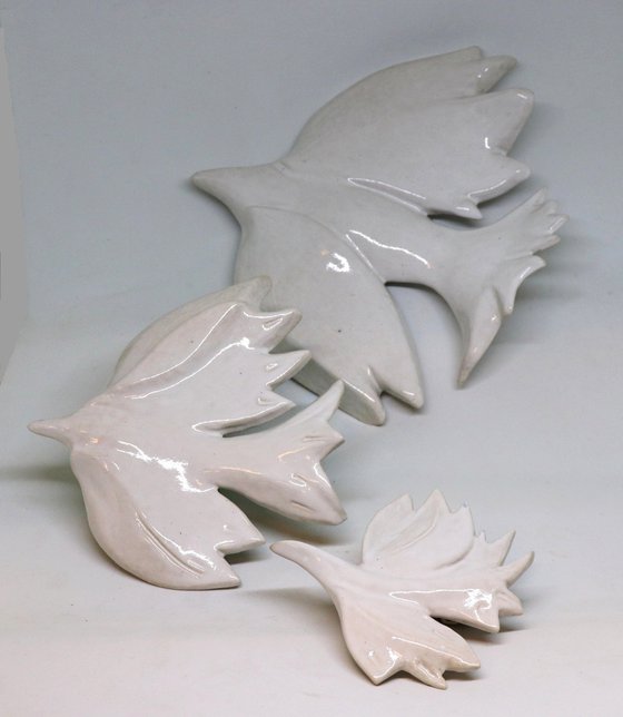 Three doves . Hanging on the wall sculpture.