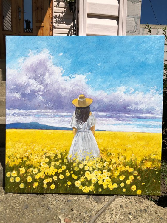 Summer. Woman in flower field