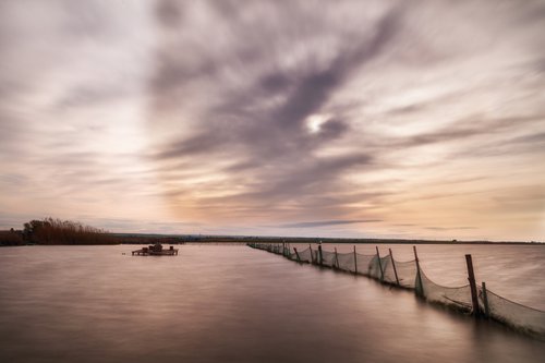 Sunset on the lake by Karim Carella