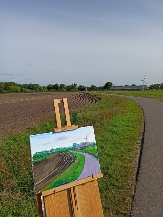 Plowed field, road and windmill . Plein Air