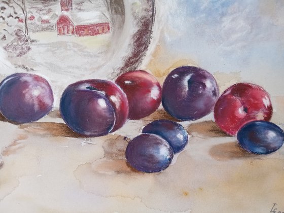 Plums rolled across the table