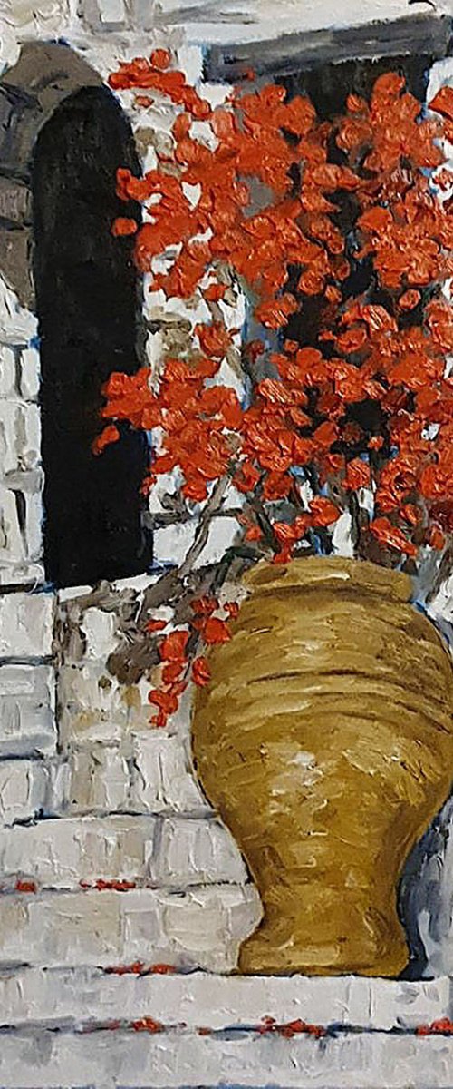 urn of red flowers on steps by Colin Ross Jack