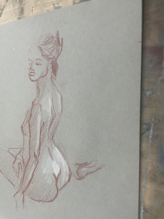 nude drawing. back-sitting model