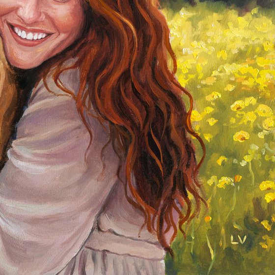 Smiling red-haired woman hugging a dog