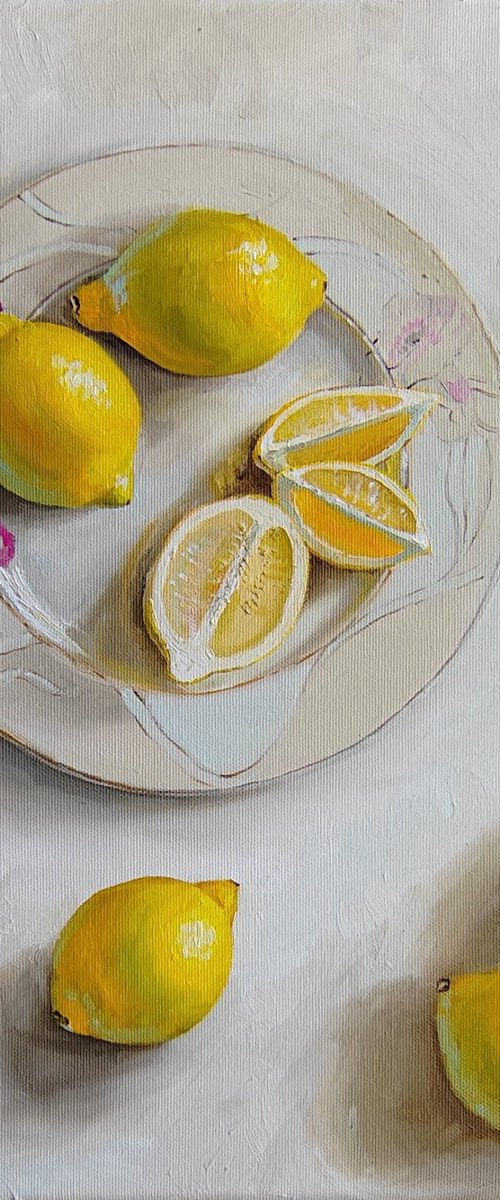 Lemon fruit on porcelain plate by Leyla Demir