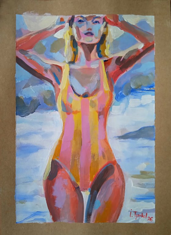 Girl in a Striped Swimsuit On the beach