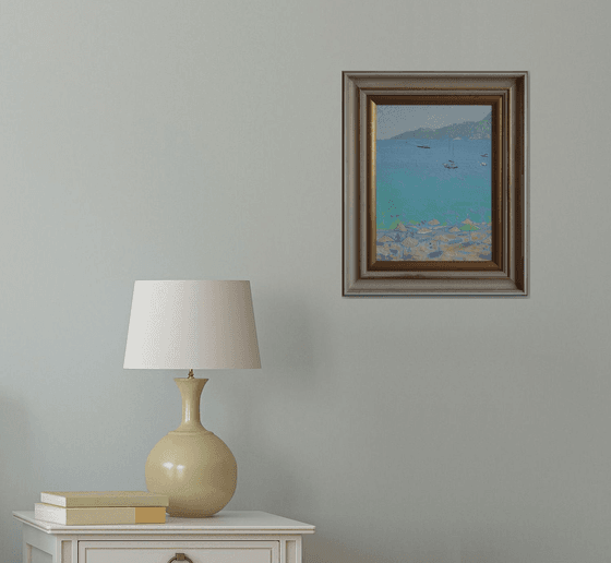 Yachts and umbrellas on the beach