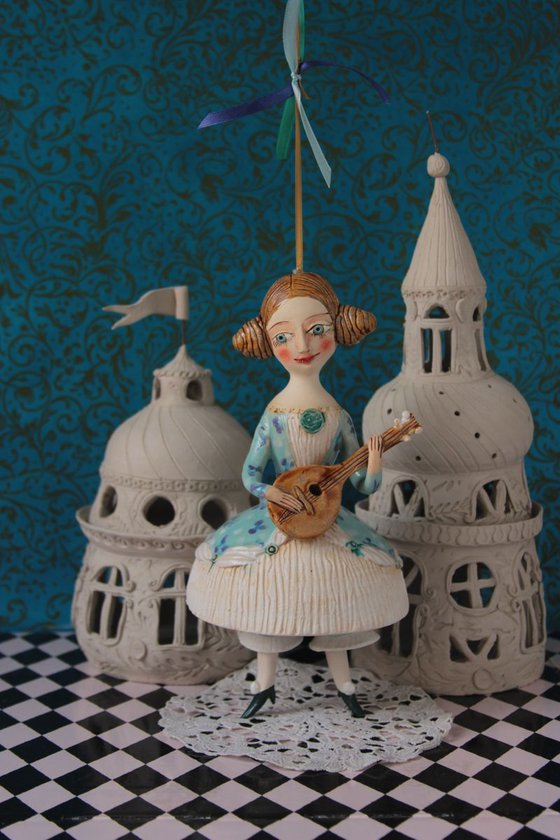 Girl with a mandoli. Ceramic hanging sculpture