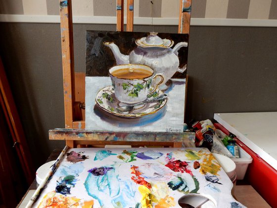 Tea cup and pot. still life