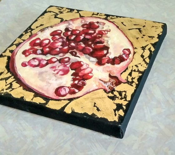Pomegranate fruit in gold
