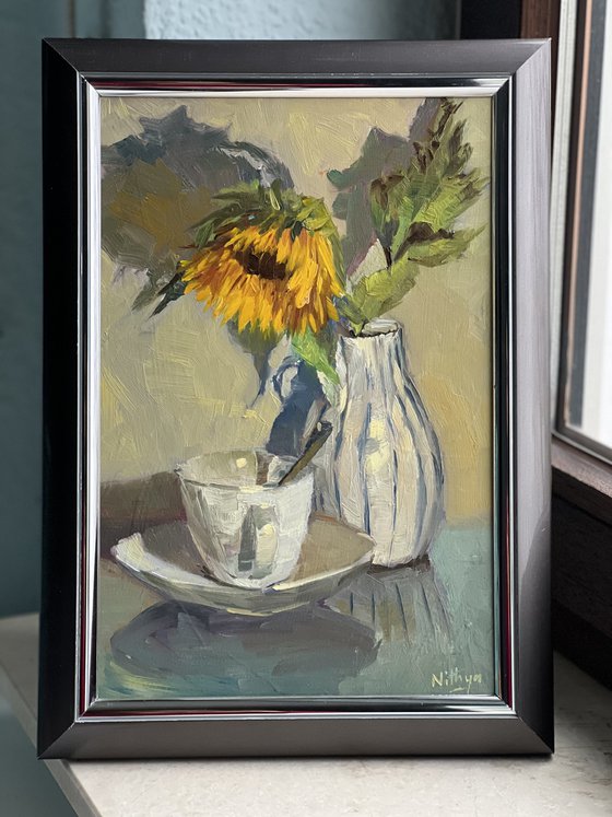 Sunflowers and a teacup