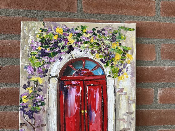 Red door with flowers