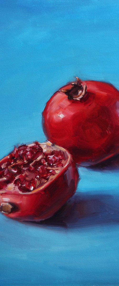 Pomegranate on a blue background by Catherine Braiko