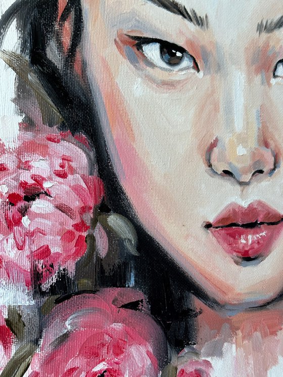 Asian woman with pink peonies