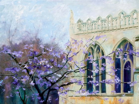 Peterborough cathedral with purple blossom