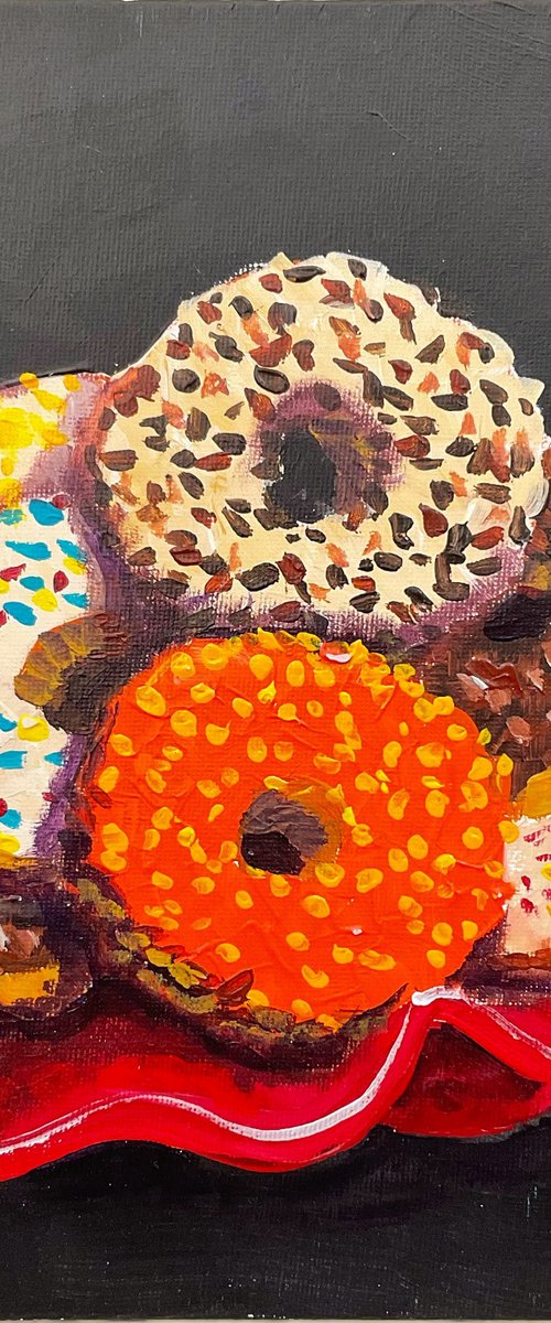 Colourful donuts in red dish by Dmitry Fedorov