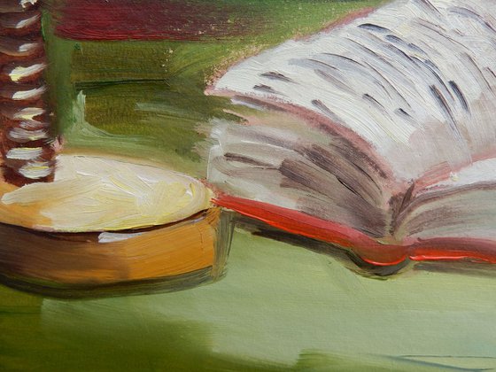 Still life oil painting with a book.