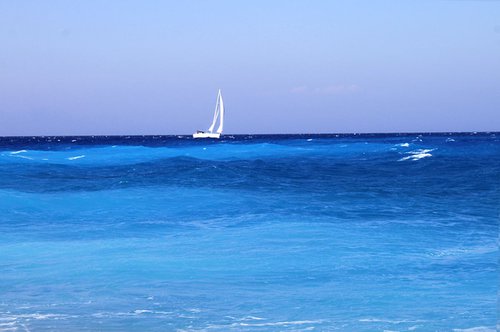 Sailboat on blue waves by Sonja  Čvorović
