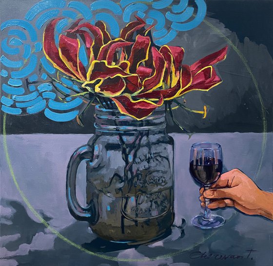 Still life with a glass of gloriosa flower and a glass of red wine