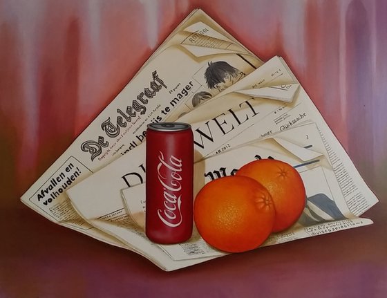 Newspaper with can and oranges