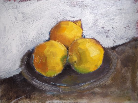 Lemons on pewter plate