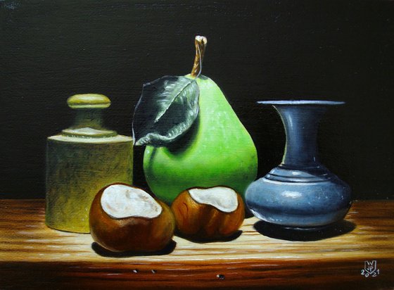 Green pear with conkers