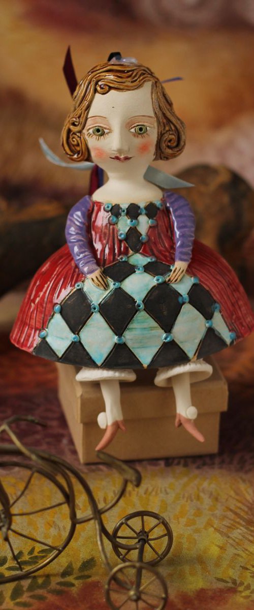 Little girl in red dress. Hanging sculpture, bell doll by Elya Yalonetski by Elya Yalonetski