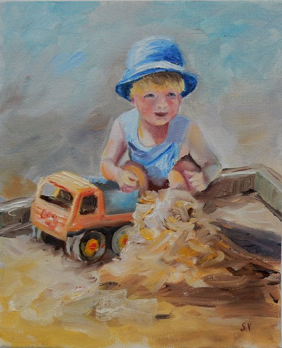 A boy plays in the sandbox. The series of paintings "Playing kids"