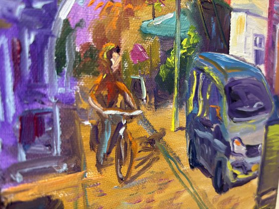 Festive Dutch town scene with cyclist