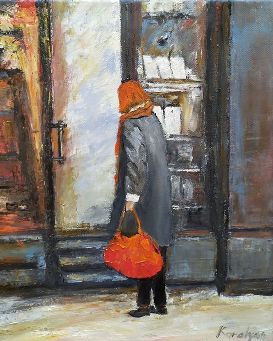 The woman with red bag