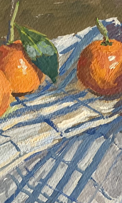 Oranges hidden under stripes by Nithya Swaminathan