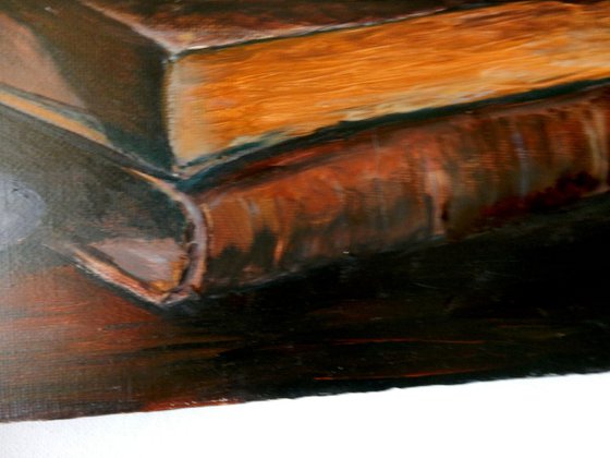 Candle and books.