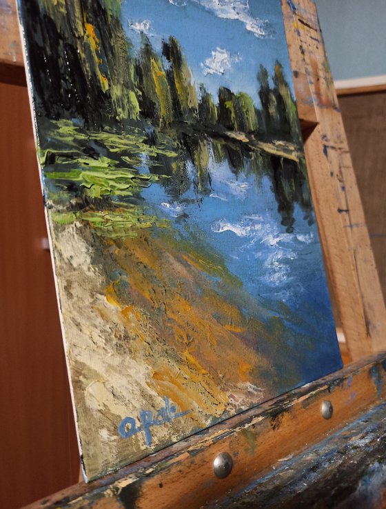 Impression. Sunny riverbank
