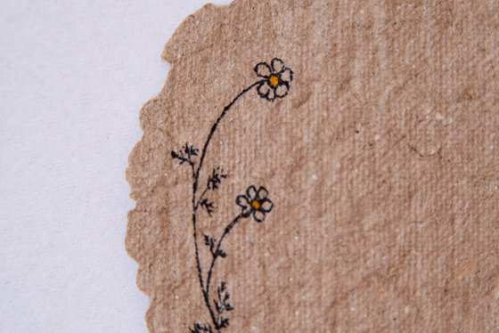 One chamomile flower drawing on the author's craft paper