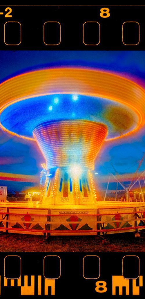 Chairoplanes Going Round by Richard Heeps