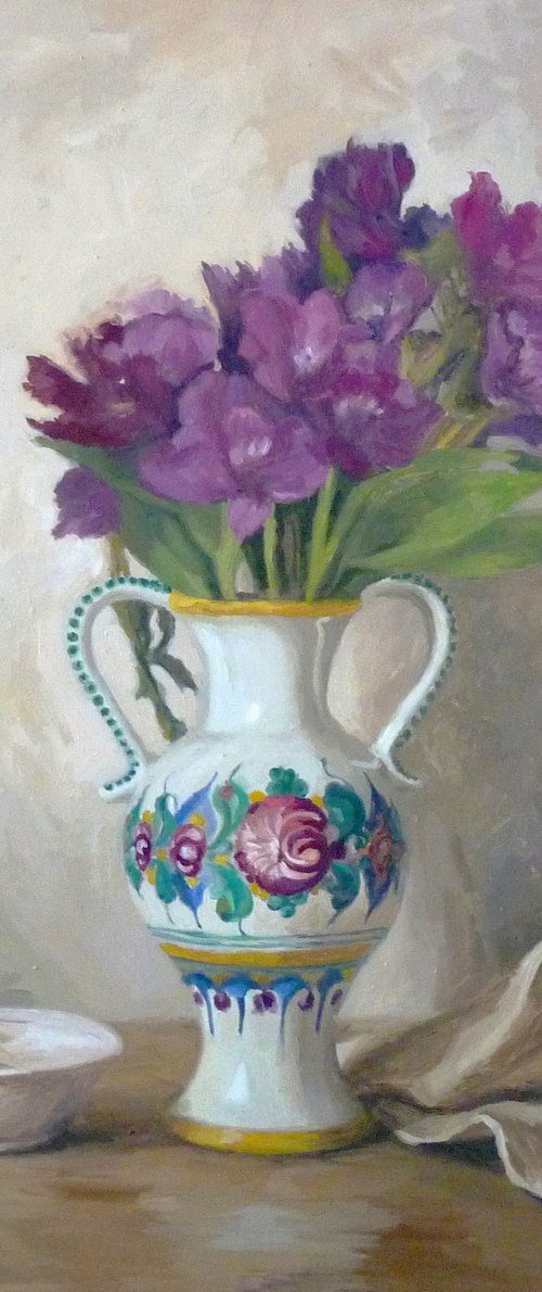 Purple flowers in a colorful jug by Radosveta Zhelyazkova