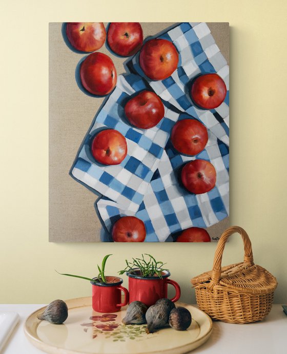 Red apples on a kitchen towel