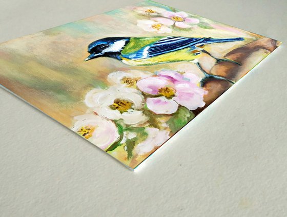 Chickadee on flowering branch
